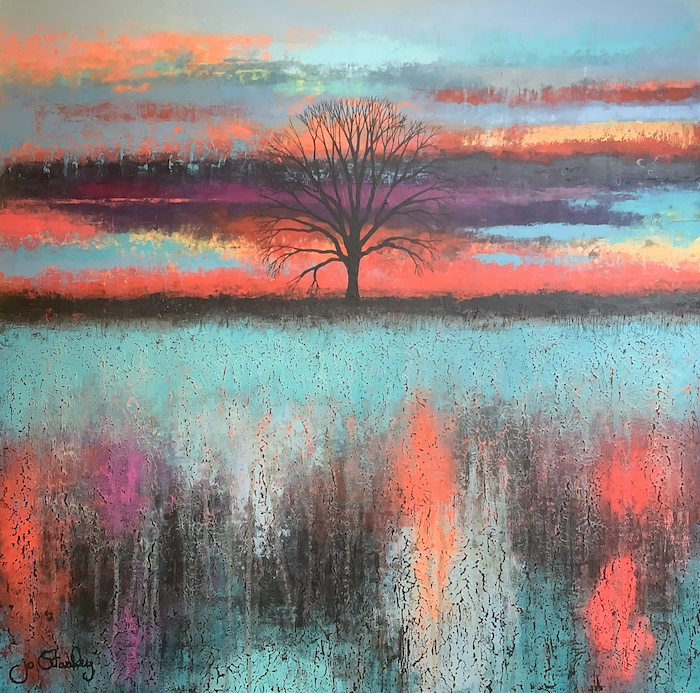 Dramatic sunset with solitary tree on horizon by Jo Starkey