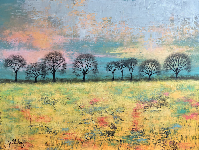 Yellow field with trees on horizon by Jo Starkey